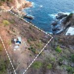 Terreno en venta sobre acantilado con vistas al mar y playa privada en Puerto Ángel - Galería